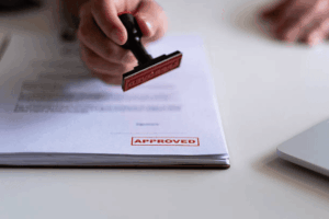 USPTO examiner stamping trademark application approved for publication during federal trademark review process