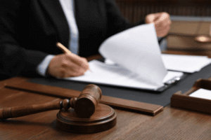 Legal professional reviewing Section 71 incontestability declaration paperwork with gavel representing USPTO post-registration trademark maintenance requirements