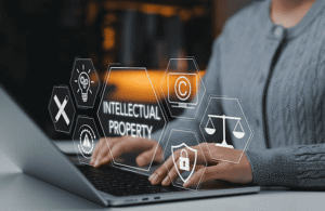 Technology business owner researching USPTO Class 9 trademark classification for software, electronics, and intellectual property protection on laptop