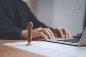 USPTO trademark examiner stamping approved Class 9 trademark application documents for technology software and electronics goods registration