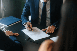 Trademark attorneys reviewing non-traditional trademark application documents with clients to secure unique brand identifiers in the U.S.