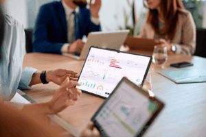 Business team analyzing brand protection strategy covering domain ownership and trademark rights in a boardroom meeting