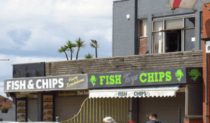 Adjacent businesses with similar "Fish & Chips" signage, illustrating trademark disputes between businesses using similar names in different states.