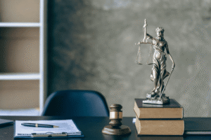 Lady Justice statue with gavel and legal books representing U.S. trademark law protecting businesses against trade dress theft and brand identity infringement