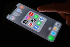 Smartphone screen displaying social media and content sharing apps representing the importance of legally protecting YouTube and digital content