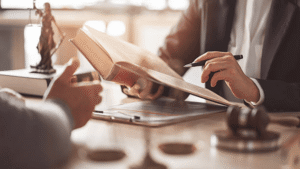 Attorneys reviewing U.S. copyright law books to advise clients on legal protection and ownership rights for AI-generated and AI-assisted content
