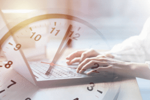 Clock overlay on laptop representing USPTO trademark registration processing time.