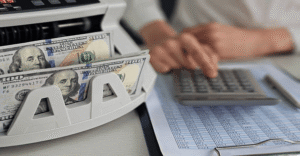 Business owner calculating trademark registration costs in Illinois including USPTO filing fees and Chicago attorney charges for 2026