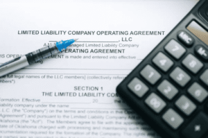 Limited liability company operating agreement and calculator representing the legal relationship between LLC formation and federal trademark registration for new businesses