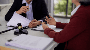 Trademark attorney reviewing Amazon Brand Registry eligibility documents with e-commerce seller to secure U.S. trademark registration and brand protection